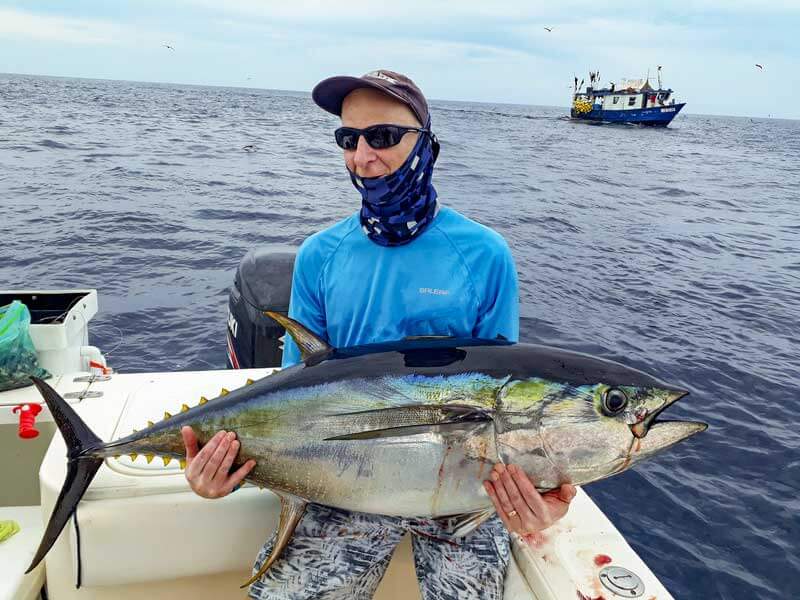 Dr. Gary Furness holding yellowfin tuna