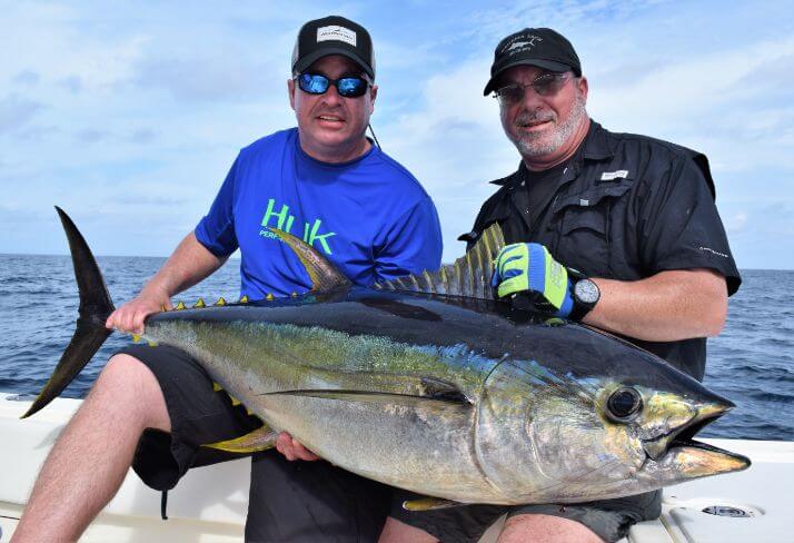 2 anglers posing with Yellowfin Tuna. Sport Fish Panama Island Lodge