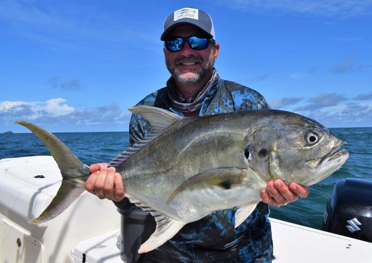 Angler posing with Jack Crevalle