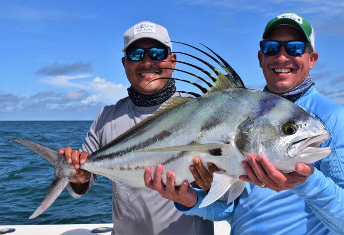 Mate and angler posing with roosterfish.