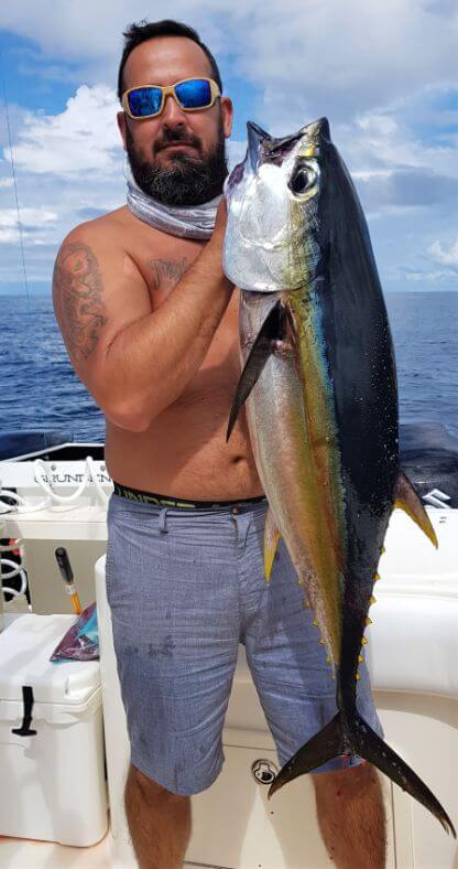 Angler holding 30 pound yellowfin tuna