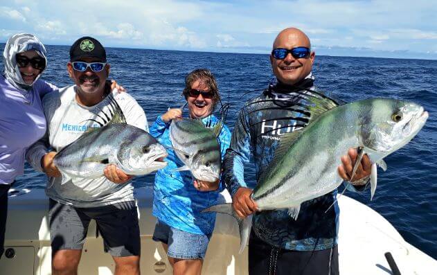 Anglers posing with roosterfish