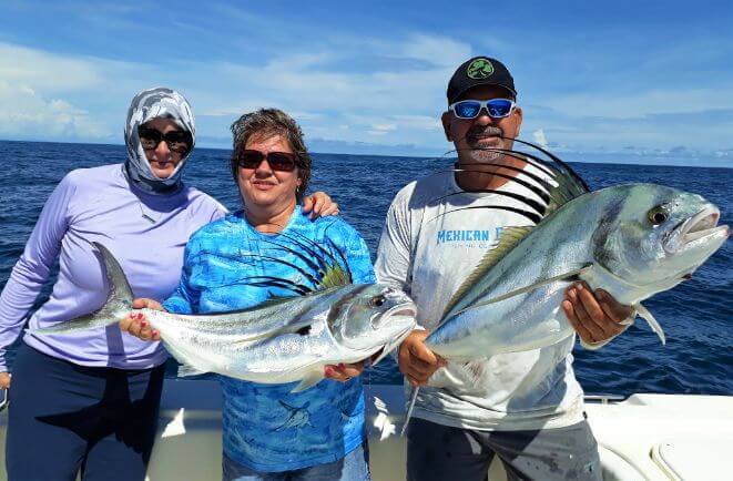 Anglers posing with roosterfish. Sport Fish Panama Island Lodge