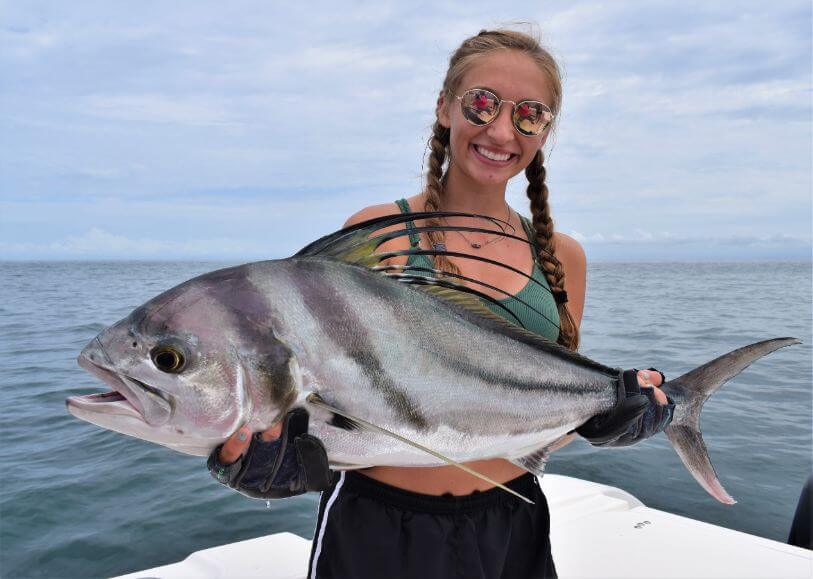Female angler posing with roosterfish