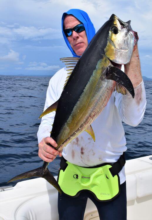 Angler posing with yellowfin tuna
