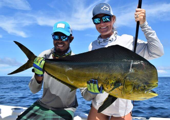 Mate and client at Sport Fish Panama Island Lodge posing with dorado