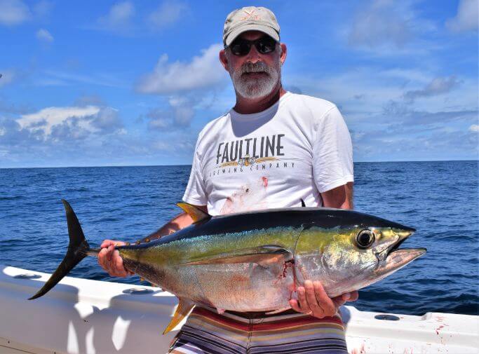 angler posing with Yellowfin tuna...   Sport Fish Panama Island Lodge