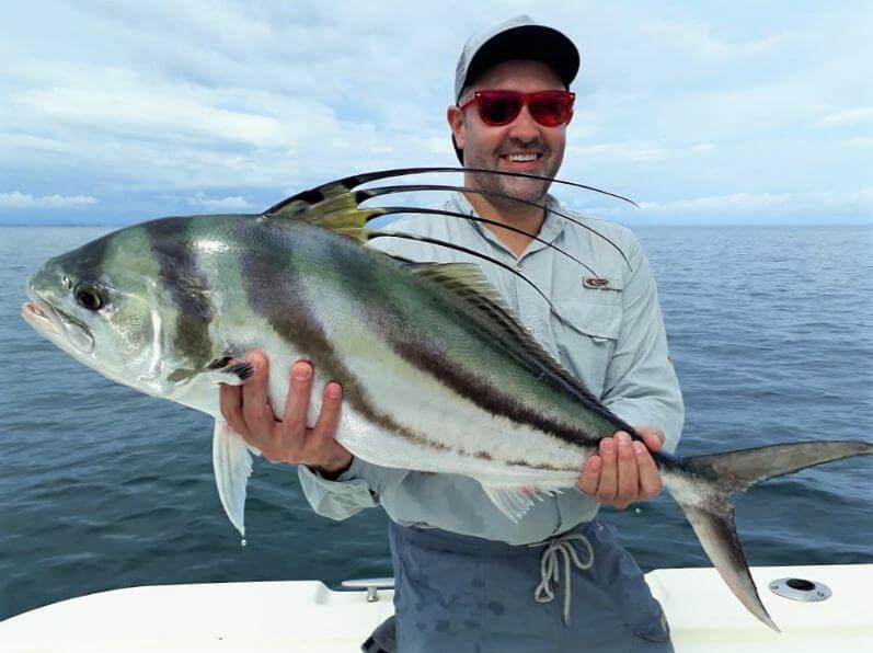 Smiling angler posing with roosterfish