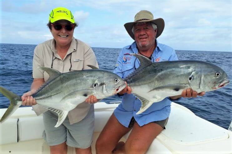 angling couple posing with Jack Crevalles
