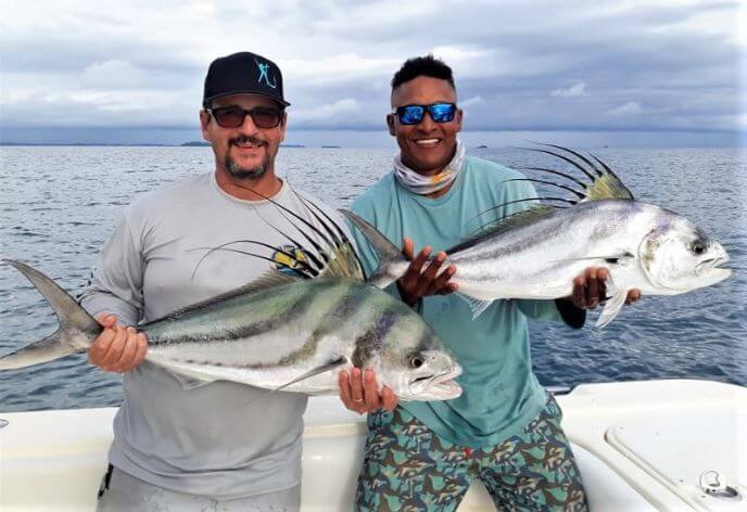 Goofy looking angler returns with Mate while holding roosterfish for photo op