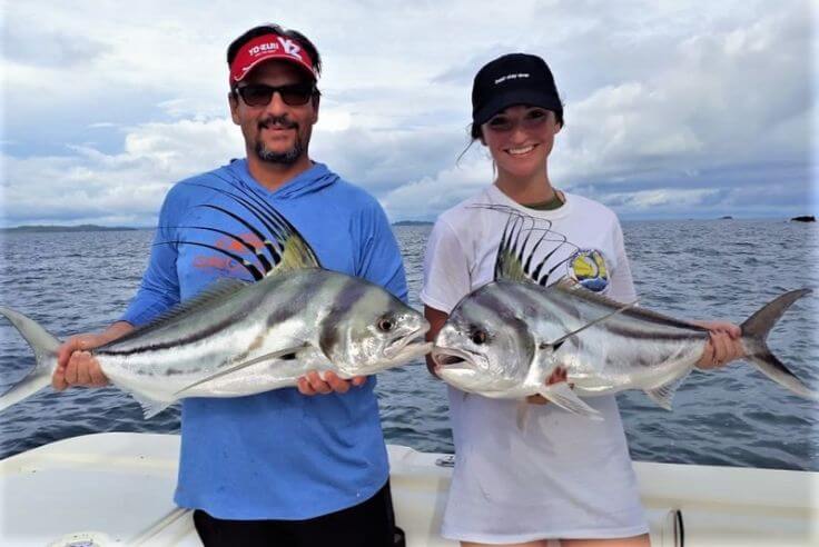 Father daughter fishing team posing with roosterfish.  Sport Fish Panama Island Lodge