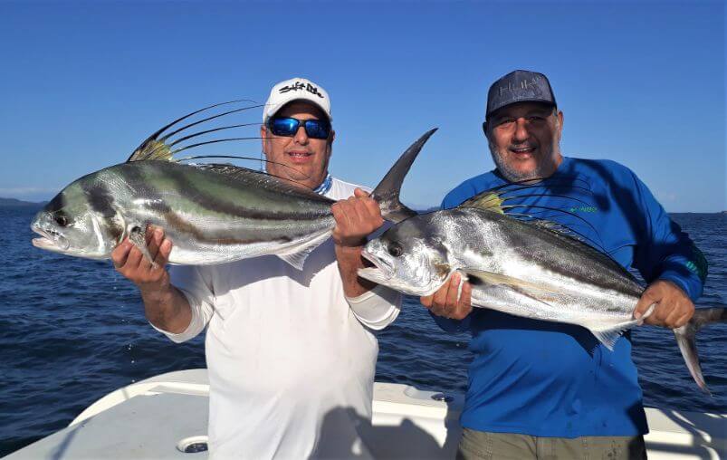 Two anglers posing with roosterfish caught at Sport Fish Panama Island Lodge