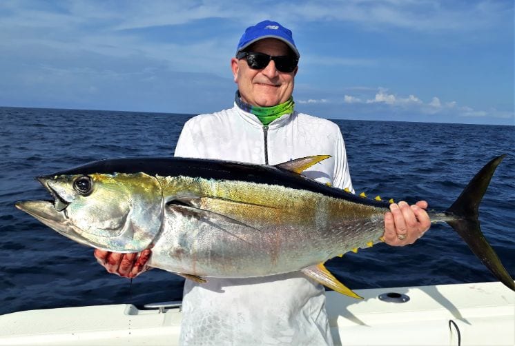 Angler holding 60 pound yellowfin tuna