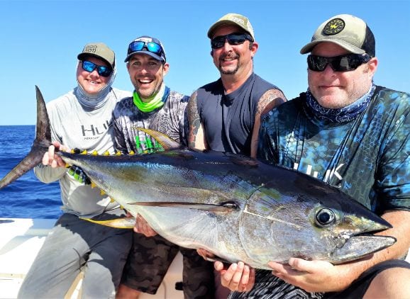 Four angler posing with Yellowfin Tuna