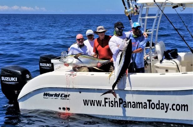Anglers aboard 33' World Cat holding yellowfin tunas