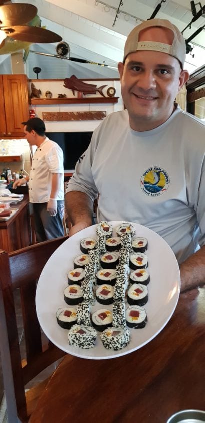 The chef at Sport Fish Panama Island Lodge holding shushi tray
