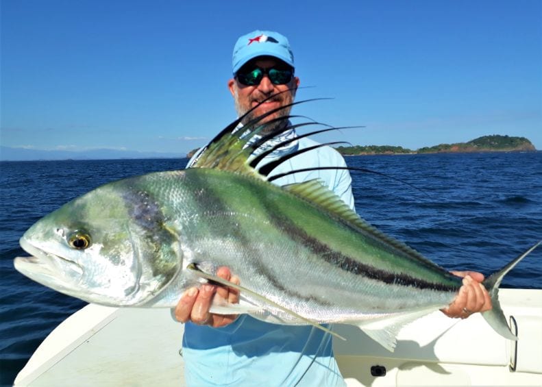 Angler posing with roosterfish for picture