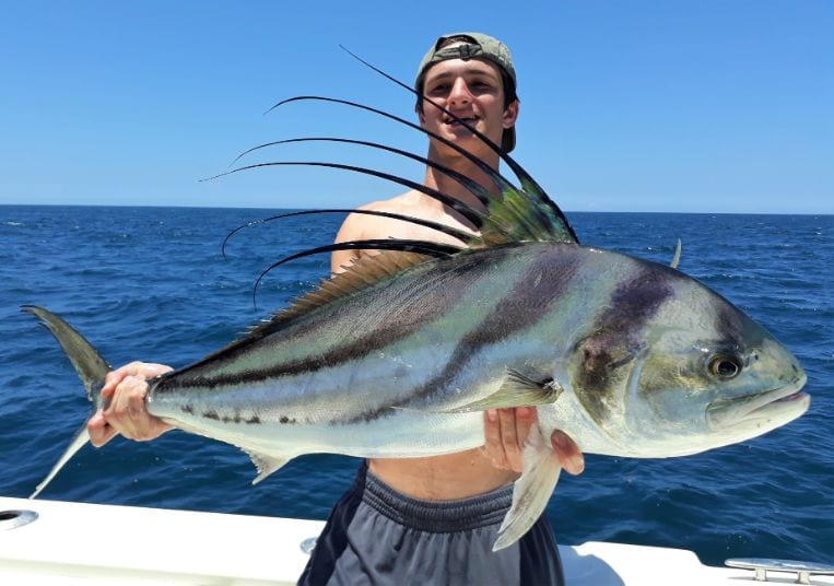 Junior angler posing with roosterfish