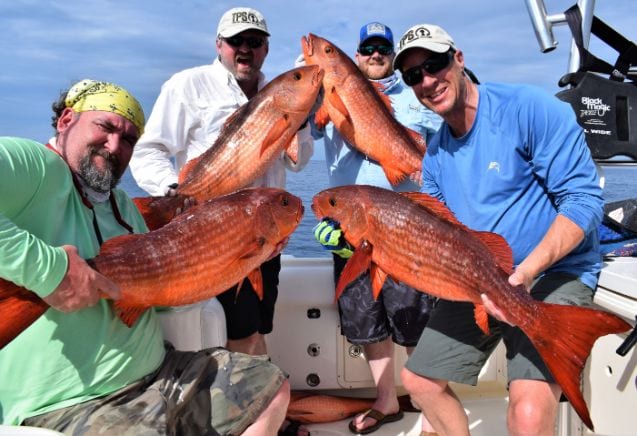 Anglers posing with Mullet Snapper