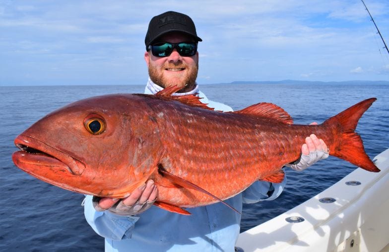 Angler posing with Mullet Snapper