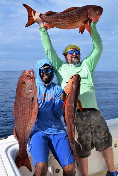 Anglers posing with Mullet Snapper