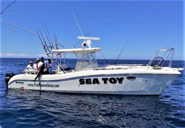 Anglers aboard the SEA TOY, hoisting yellowfin tuna aboard