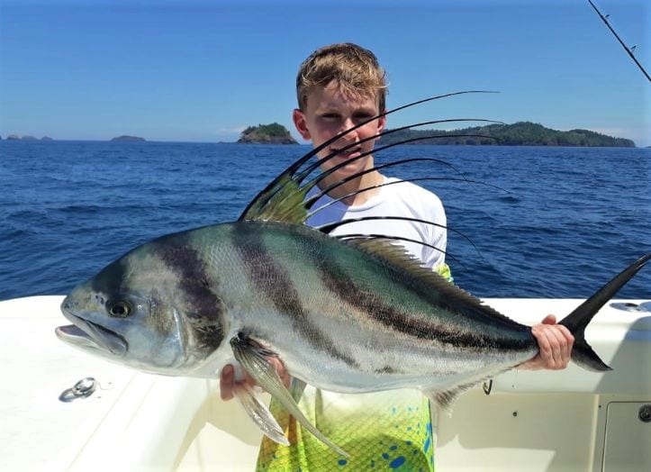 Young angler posing with roosterfish