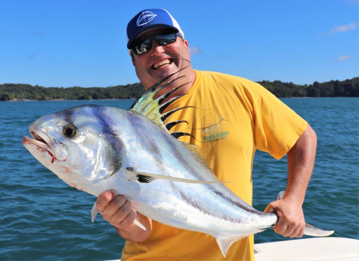 angler posing with roosterfish