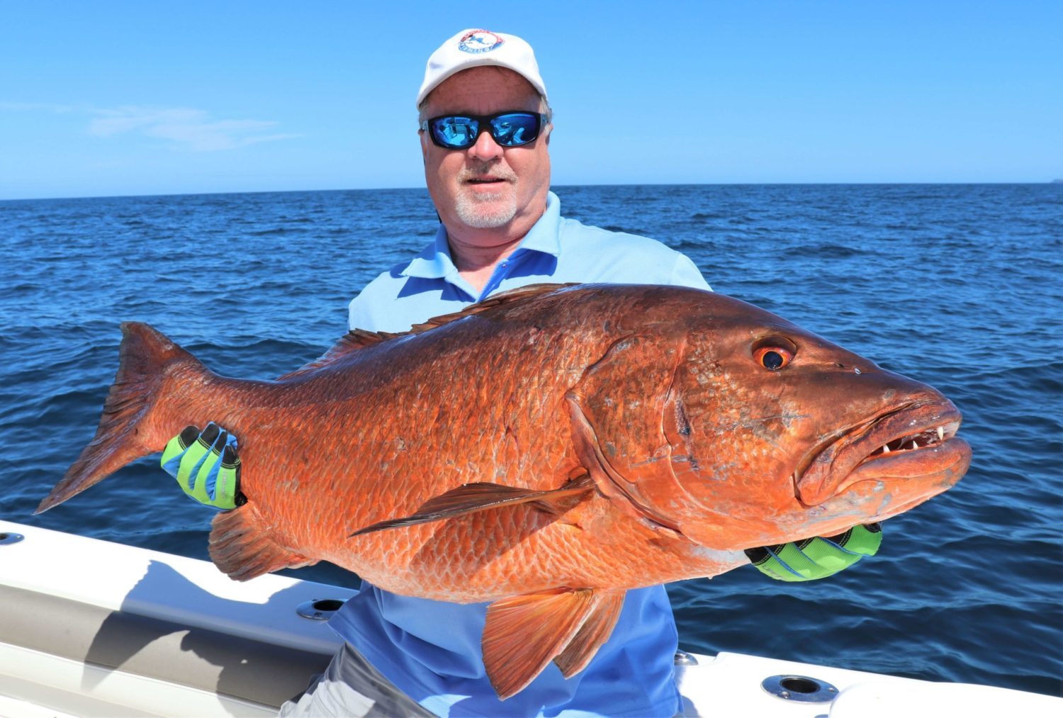 Man Holding Cubera Snapper in Panama fishing