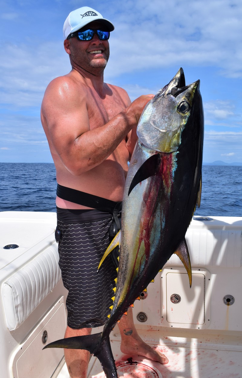 Angler holding yellowfin tuna