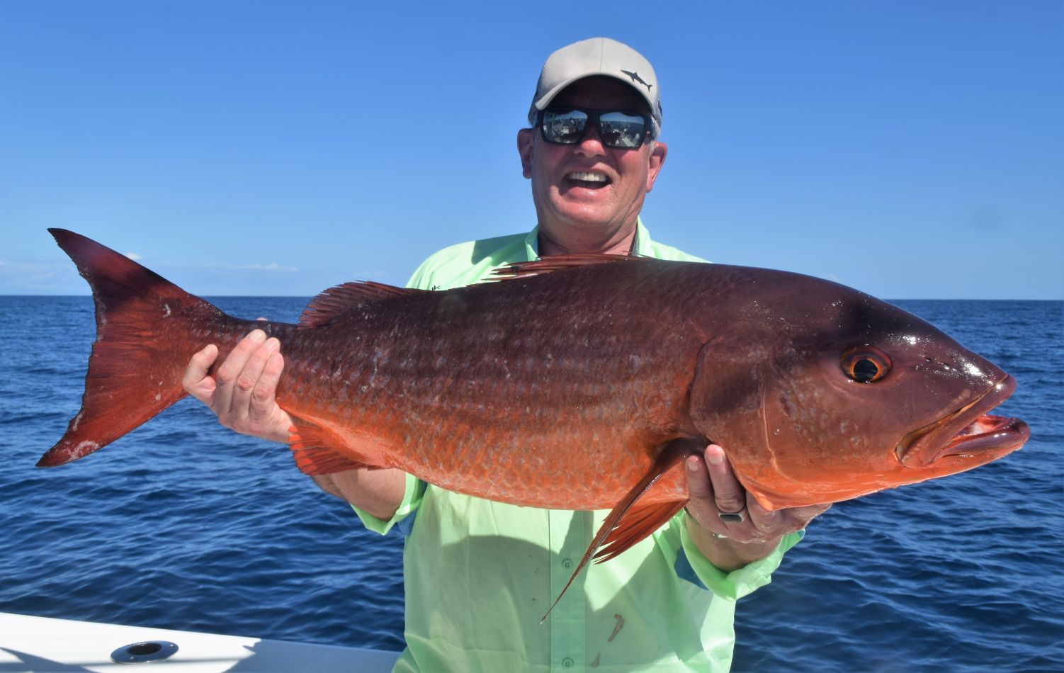 Angler holding Mullet Snapper