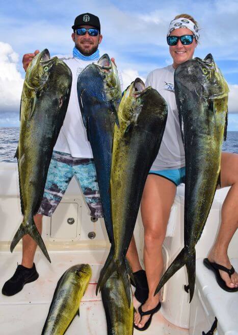 Angling couple posing with Dorado, also known as ‘Mahi-Mahi’ or ‘Dolphin’
