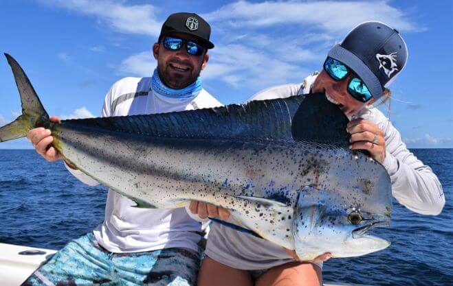 Angling couple posing with Dorado, also known as ‘Mahi-Mahi’ or ‘Dolphin’