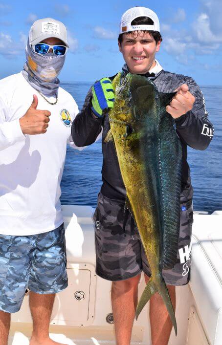 angler posing with  Dorado, also known as ‘Mahi-Mahi’ or ‘Dolphin’