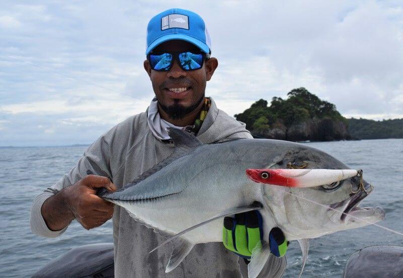 Mate posing with Horse-eye Jack which has lure still in mouth