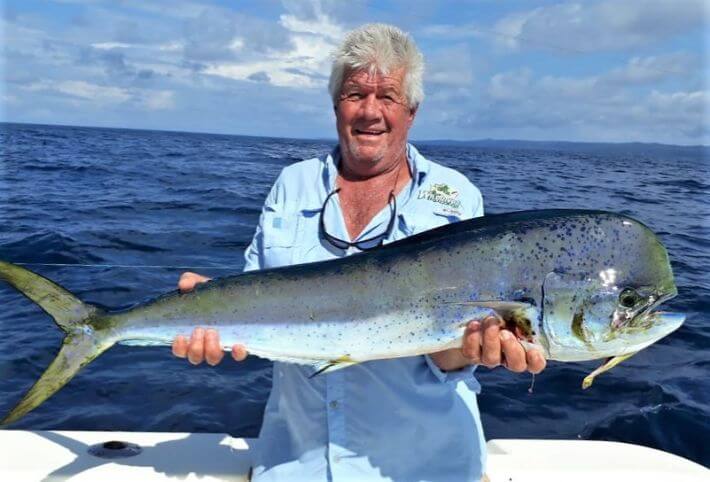 Angler posing with Dorado, also known as ‘Mahi-Mahi’ or ‘Dolphin’