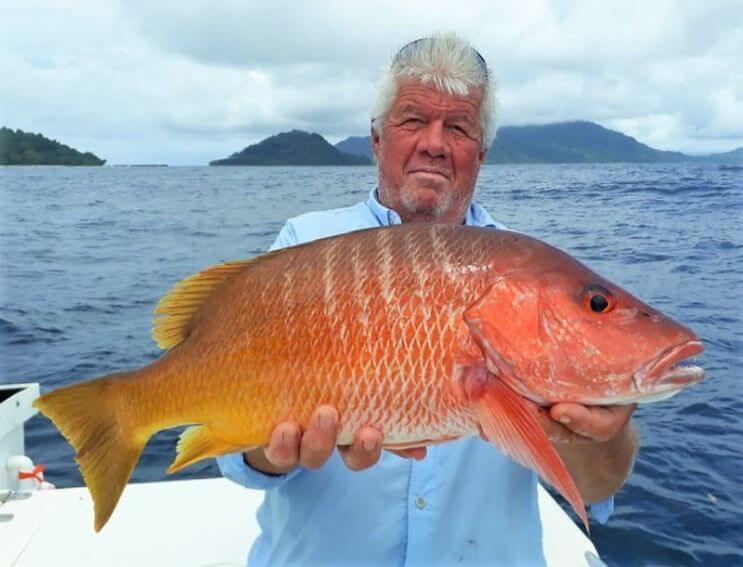 Angler posing with cubera snapper
