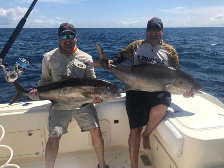 Anglers posing with just caught fish