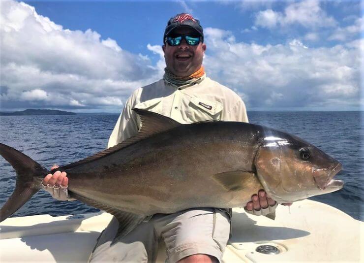 Angler posing with amberjack
