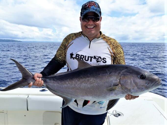 Angler posing with amberjack
