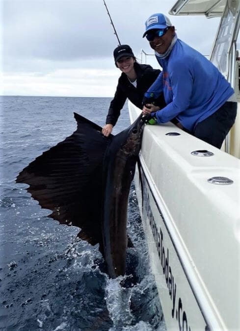 Mate releasing a Pacific Sailfish or 'Pez Vela'