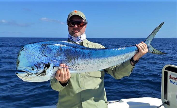 Angler with Dorado, also known as ‘Mahi-Mahi’ or ‘Dolphin’