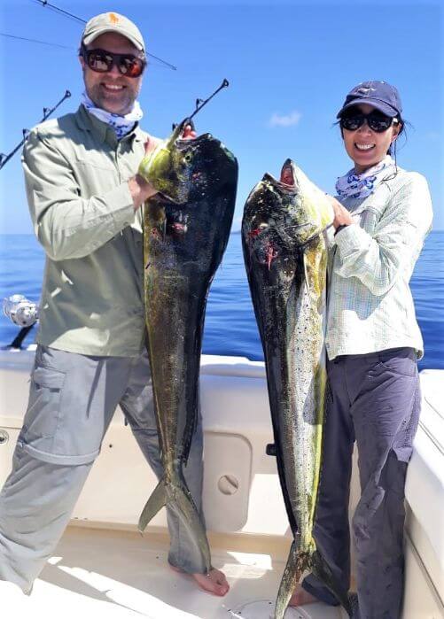 Angeling couple posing with Dorado, also known as ‘Mahi-Mahi’ or ‘Dolphin’